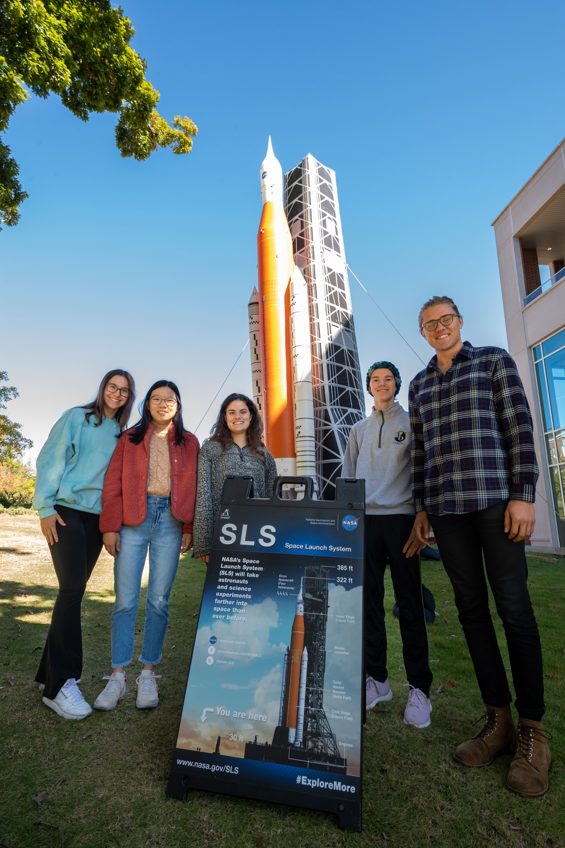Student employees in the Industry Design Experience for Auburn Students, or IDEAS, program stand by a blow-up replica of the Space Launch System they are working on. Pictured are&amp; Regan Clare, junior in mechanical engineering; Ashley Eng, junior in mechanical&amp; engineering; Jessica Ruiz, junior in mechanical&amp; engineering; Matthew Gillis, senior in mechanical&amp; engineering&amp; and applied mathematics; and Bradley Conrad, senior in mechanical engineering.