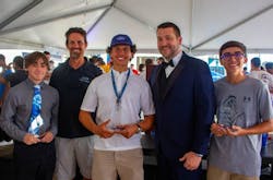 Scholarship winners and presenters (L-R): Landon Bosco, Epic Founder and CEO Danny Perna, Aaron Perez, New Smyrna Beach Mayor Russ Owen, and Austin White (Not pictured: Ethan Harpending and Roland Ireland) Scholarship winners and presenters (L-R): Landon Bosco, Epic Founder and CEO Danny Perna, Aaron Perez, New Smyrna Beach Mayor Russ Owen, and Austin White (Not pictured: Ethan Harpending and Roland Ireland)