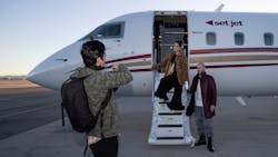 Actors Vanessa Hudgens, center, and Oliver Trevena, right, pose for photographs in front of a Set Jet aircraft during a groundbreaking event at the Atlantic Aviation terminal on Tuesday, Dec. 13, 2022, in Las Vegas. Set Jet is a subscription flight service using private jets. (Ellen Schmidt/Las Vegas Review-Journal) @ellenschmidttt Actors Vanessa Hudgens, center, and Oliver Trevena, right, pose for photographs in front of a Set Jet aircraft during a groundbreaking event at the Atlantic Aviation terminal on Tuesday, Dec. 13, 2022, in Las Vegas. Set Jet is a subscription flight service using private jets. (Ellen Schmidt/Las Vegas Review-Journal) @ellenschmidttt