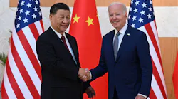 US President Joe Biden (right) and China's President Xi Jinping (left) shake hands as they meet on the sidelines of the G20 Summit in Nusa Dua on the Indonesian resort island of Bali on Nov. 14, 2022.