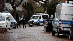 Police stand outside a residence that they raided earlier today on Dec. 7, 2022, in Berlin, Germany. Law enforcement agencies conducted raids nationwide today and arrested 25 people whom they claim are in an organization bent on violently overthrowing the German government. Police stand outside a residence that they raided earlier today on Dec. 7, 2022, in Berlin, Germany. Law enforcement agencies conducted raids nationwide today and arrested 25 people whom they claim are in an organization bent on violently overthrowing the German government.