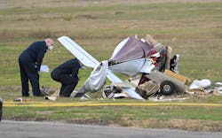 Torrance, California November 30, 2022-Investigators look over a plane that crashed and killed two people at Torrance Airport Wednesday morning.