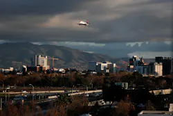 SAN JOSE, CALIFORNIA - DECEMBER 8: An airplane flies over downtown San Jose, Calif., into the the Mineta San Jose Airport on Sunday, Dec. 8, 2019.