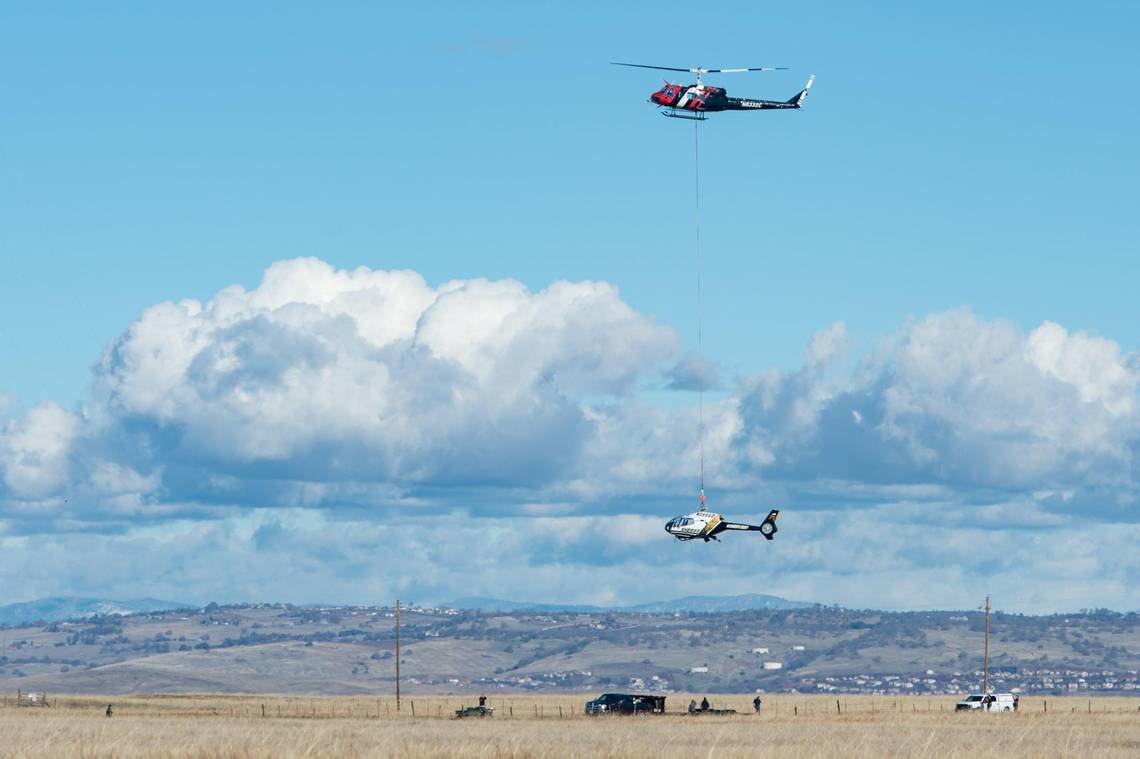 A Sacramento Sheriff s helicopter is airlifted Monday to a flatbed truck from the location of its emergency landing Sunday in a muddy field near Grant Line and Douglas roads, east of Rancho Cordova.