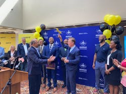 Gov. Ned Lamont, at right, holds up a model of a Spirit Airline passenger aircraft presented to him in September by Spirit's Senior Director, Airports Atul Kumria. The gift marked the announcement at Bradley International Airport that Spirit will offer a nonstop flight to Jamaica.