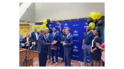 Gov. Ned Lamont, at right, holds up a model of a Spirit Airline passenger aircraft presented to him in September by Spirit's Senior Director, Airports Atul Kumria. The gift marked the announcement at Bradley International Airport that Spirit will offer a nonstop flight to Jamaica.
