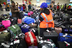 Southwest Airlines employees and passengers look through large groups of luggage in the Terminal 2 baggage claim area of the Oakland International Airport on Tuesday, Dec. 27, 2022. Southwest Airlines employees and passengers look through large groups of luggage in the Terminal 2 baggage claim area of the Oakland International Airport on Tuesday, Dec. 27, 2022.