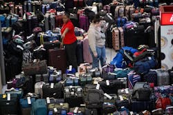 An employee at the Sacramento International Airport Terminal B near the Southwest carousel points to luggage on Tuesday, Dec. 27, 2022, that is being held after canceled and delayed flights over the Christmas rush. An employee at the Sacramento International Airport Terminal B near the Southwest carousel points to luggage on Tuesday, Dec. 27, 2022, that is being held after canceled and delayed flights over the Christmas rush.