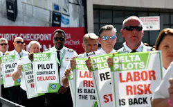 Delta pilots conduct informational picketing at the south terminal at Hartsfield-Jackson Atlanta International Airport ahead of the busy Labor Day travel weekend as they push for a new labor contract on Sept. 1, 2022. Delta pilots conduct informational picketing at the south terminal at Hartsfield-Jackson Atlanta International Airport ahead of the busy Labor Day travel weekend as they push for a new labor contract on Sept. 1, 2022.