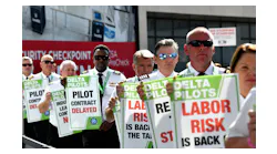 Delta pilots conduct informational picketing at the south terminal at Hartsfield-Jackson Atlanta International Airport ahead of the busy Labor Day travel weekend as they push for a new labor contract on Sept. 1, 2022.