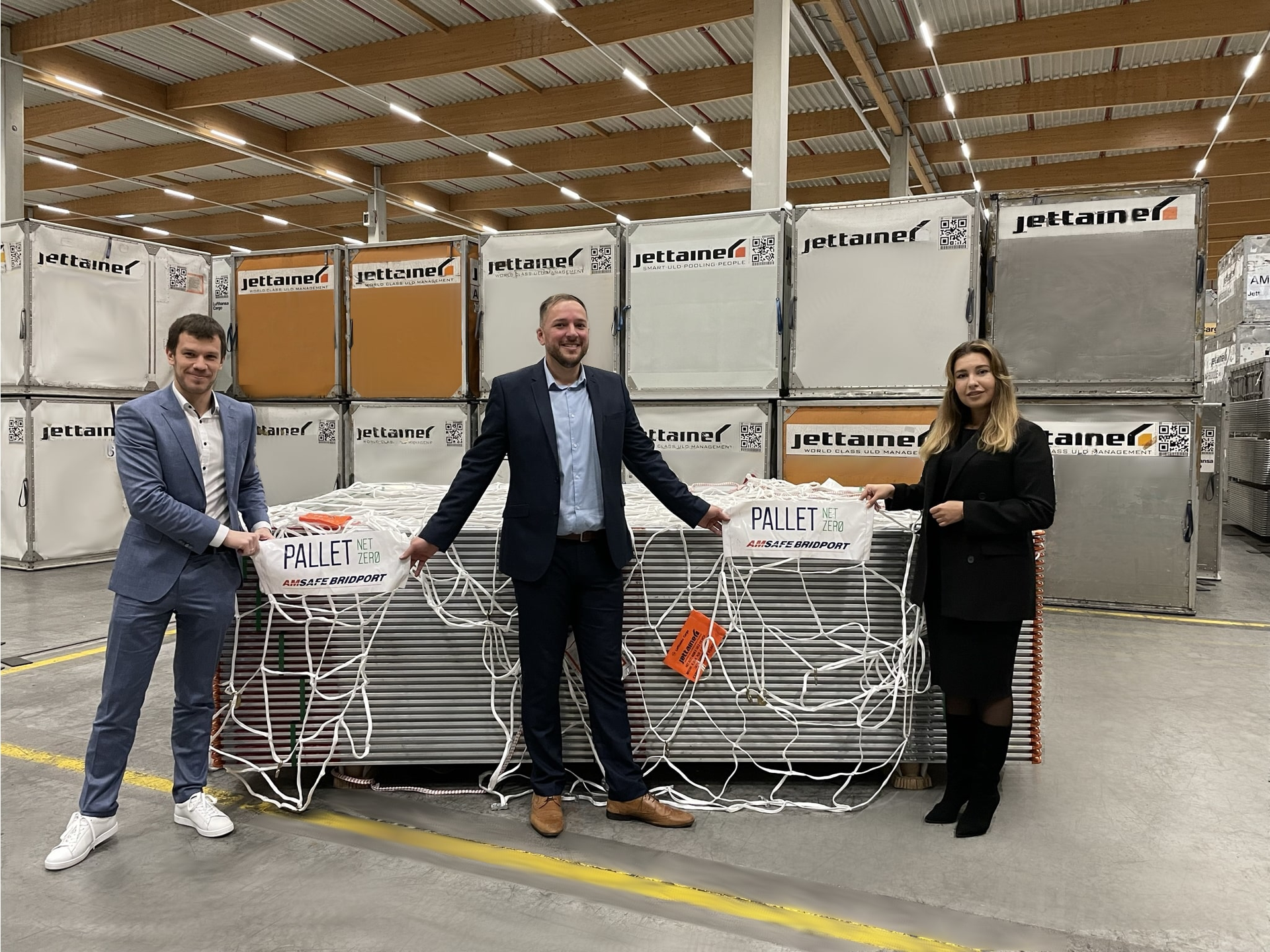 Alexander Grosman, senior ULD engineer at Jettainer, Adam Polley, senior sales manager at Bridport, and Adeliya Sofina, environmental coordinator and manager strategic procurement at Jettainer, with the new Pallet Net Zero.