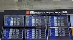 Monitors with all departures and arrivals flights at Charles de Gaulle International Airport, in Paris.