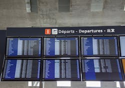Monitors with all departures and arrivals flights at Charles de Gaulle International Airport, in Paris.