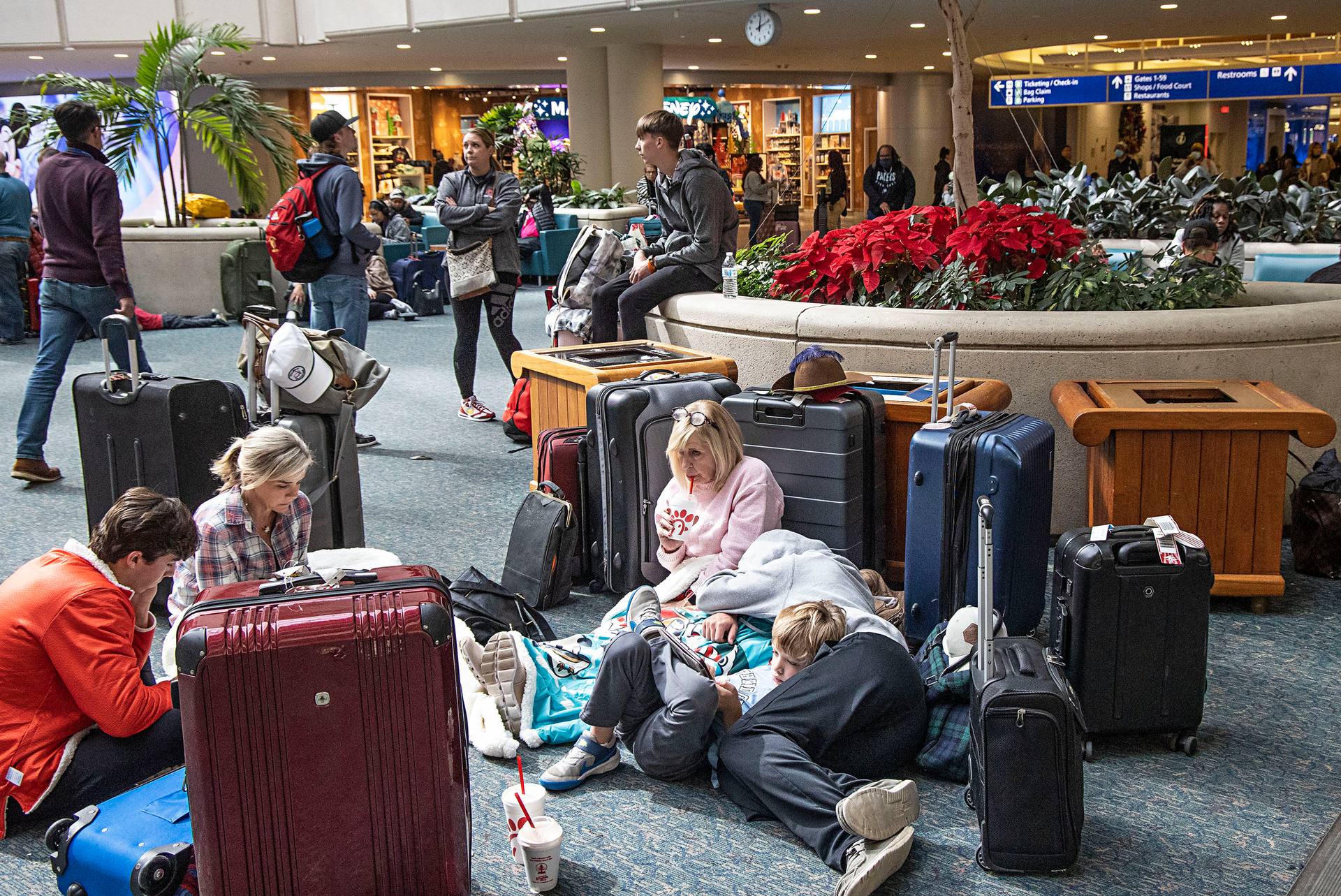 Canceled and delayed flights at Orlando International Airport caused by the winter storm left people to wait for flights in Orlando, Florida, Dec. 26, 2022.