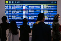People wait in front a board showing international flight arrivals at Tokyo's Haneda international airport on Wednesday, Dec. 28, 2022. Hong Kong authorities asked Japan to remove restrictions on direct flights from the city, which were imposed following the explosion of coronavirus cases in mainland China. People wait in front a board showing international flight arrivals at Tokyo's Haneda international airport on Wednesday, Dec. 28, 2022. Hong Kong authorities asked Japan to remove restrictions on direct flights from the city, which were imposed following the explosion of coronavirus cases in mainland China.