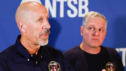 National Transportation Safety Board member Michael Graham (left) answers questions as senior air safety investigator Jason Aguilera listens during a press conference about the NTSB s investigation into the airshow plane collision at the Dallas Executive Airport Terminal in November. National Transportation Safety Board member Michael Graham (left) answers questions as senior air safety investigator Jason Aguilera listens during a press conference about the NTSB s investigation into the airshow plane collision at the Dallas Executive Airport Terminal in November.