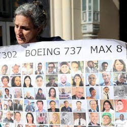 Nadia Millerson, the mother of Samya Stumo who was killed in one of the two plane crashes involving a Boeing 737 MAX, unfurls a banner with photographs of some of the victims following an arraignment at the federal courthouse in Fort Worth on Thursday, January 26, 2023, at the federal court in Fort Worth. She and other family members attended an arraignment challenging the plea agreement Boeing made with the Justice Department that granted them immunity from criminal prosecution.