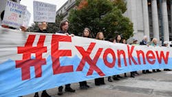 Climate activists protest on the first day of the Exxon Mobil trial outside the New York State Supreme Court building on Oct. 22, 2019, in New York City. New York’s attorney general was taking on Exxon Mobil in a landmark case that accused the oil giant of misleading investors about the company’s financial risks due to climate change. Climate activists protest on the first day of the Exxon Mobil trial outside the New York State Supreme Court building on Oct. 22, 2019, in New York City. New York’s attorney general was taking on Exxon Mobil in a landmark case that accused the oil giant of misleading investors about the company’s financial risks due to climate change.