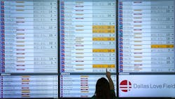 Flight status boards show Southwest flights either canceled or delayed up and down the board at Dallas Love Field. Flight status boards show Southwest flights either canceled or delayed up and down the board at Dallas Love Field.