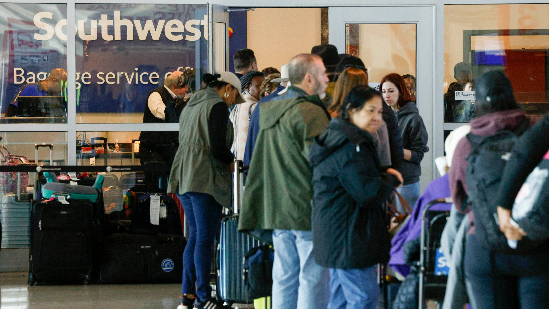 Travelers waited in line outside the Southwest Airlines baggage service office at Love Field Airport in Dallas on Dec. 28.