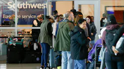 Travelers waited in line outside the Southwest Airlines baggage service office at Love Field Airport in Dallas on Dec. 28.