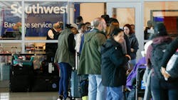 Travelers waited in line outside the Southwest Airlines baggage service office at Love Field Airport in Dallas on Dec. 28. Travelers waited in line outside the Southwest Airlines baggage service office at Love Field Airport in Dallas on Dec. 28.