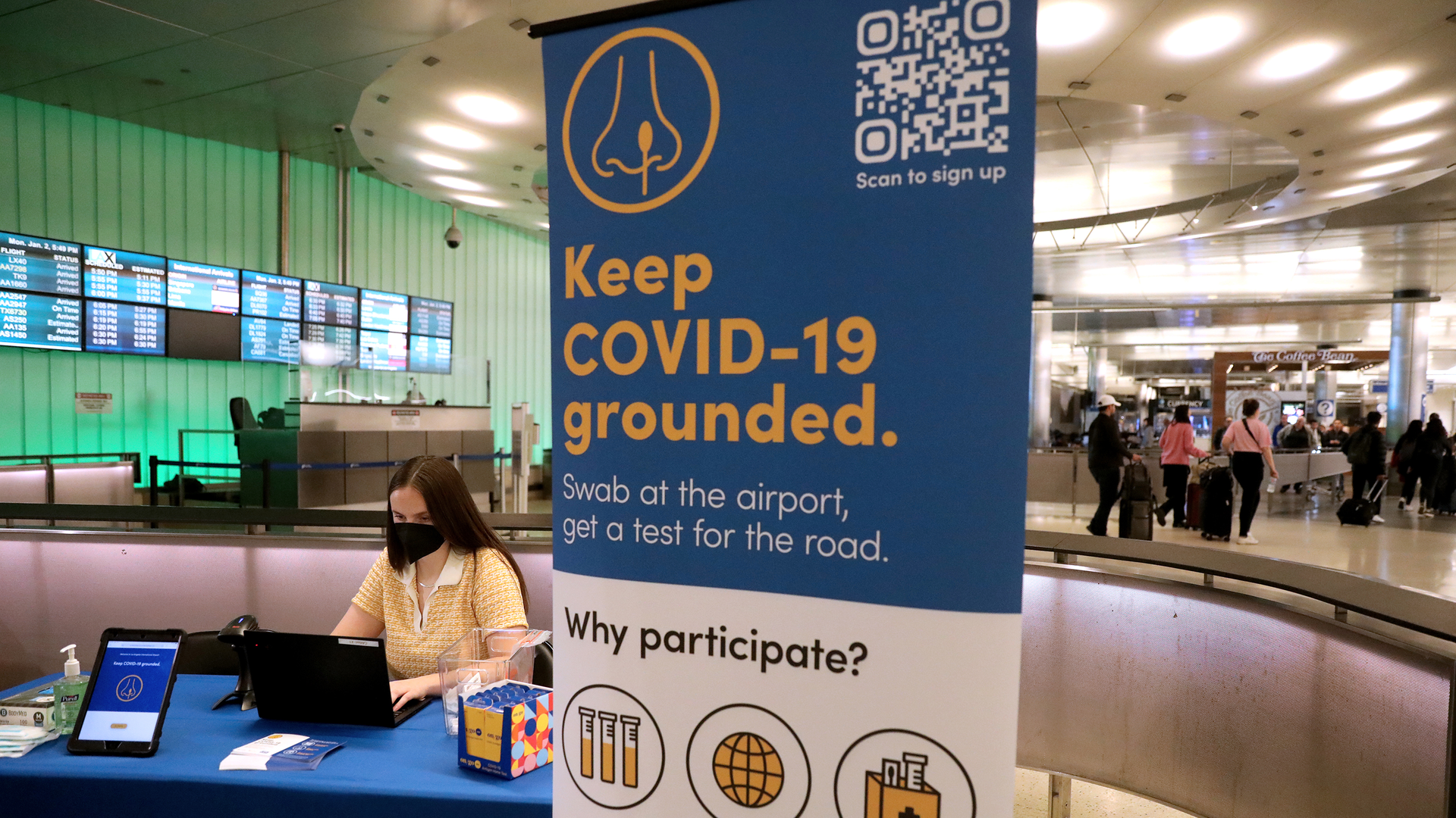 Claire Altieri, senior associate of Concentric by Ginkgo, sets up a pooled PCR testing site for COVID-19 variants at a new test facility at Tom Bradley International Terminal that health officials hope will help them spot new variants that may emerge from passengers arriving from other countries at Los Angeles International Airport on Jan. 2, 2023, in Los Angeles.