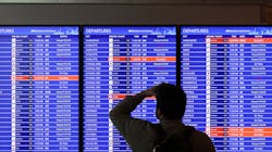 A traveler looks at a flight information board at Ronald Reagan Washington National Airport on Jan. 11, 2023, in Arlington, Virginia. The FAA said it is gradually resuming flights around the country after an outage to the Notice to Air Mission System, a computer system that helps guide air traffic. A traveler looks at a flight information board at Ronald Reagan Washington National Airport on Jan. 11, 2023, in Arlington, Virginia. The FAA said it is gradually resuming flights around the country after an outage to the Notice to Air Mission System, a computer system that helps guide air traffic.