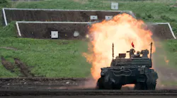 A Japan Ground Self-Defense Force (JGSDF) Type 10 battle tank fires ammunition during a live fire exercise at East Fuji Maneuver Area in Gotemba on May 28, 2022.