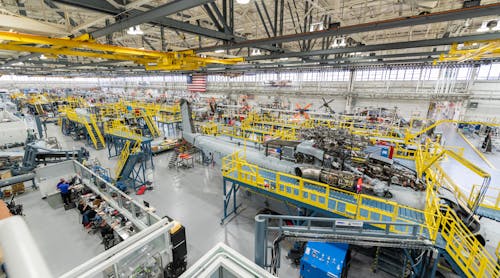 Sikorsky employees building CH-53K aircraft utilizing 3-D work instructions, new titanium machining centers with multi-floor ergonomic platforms.