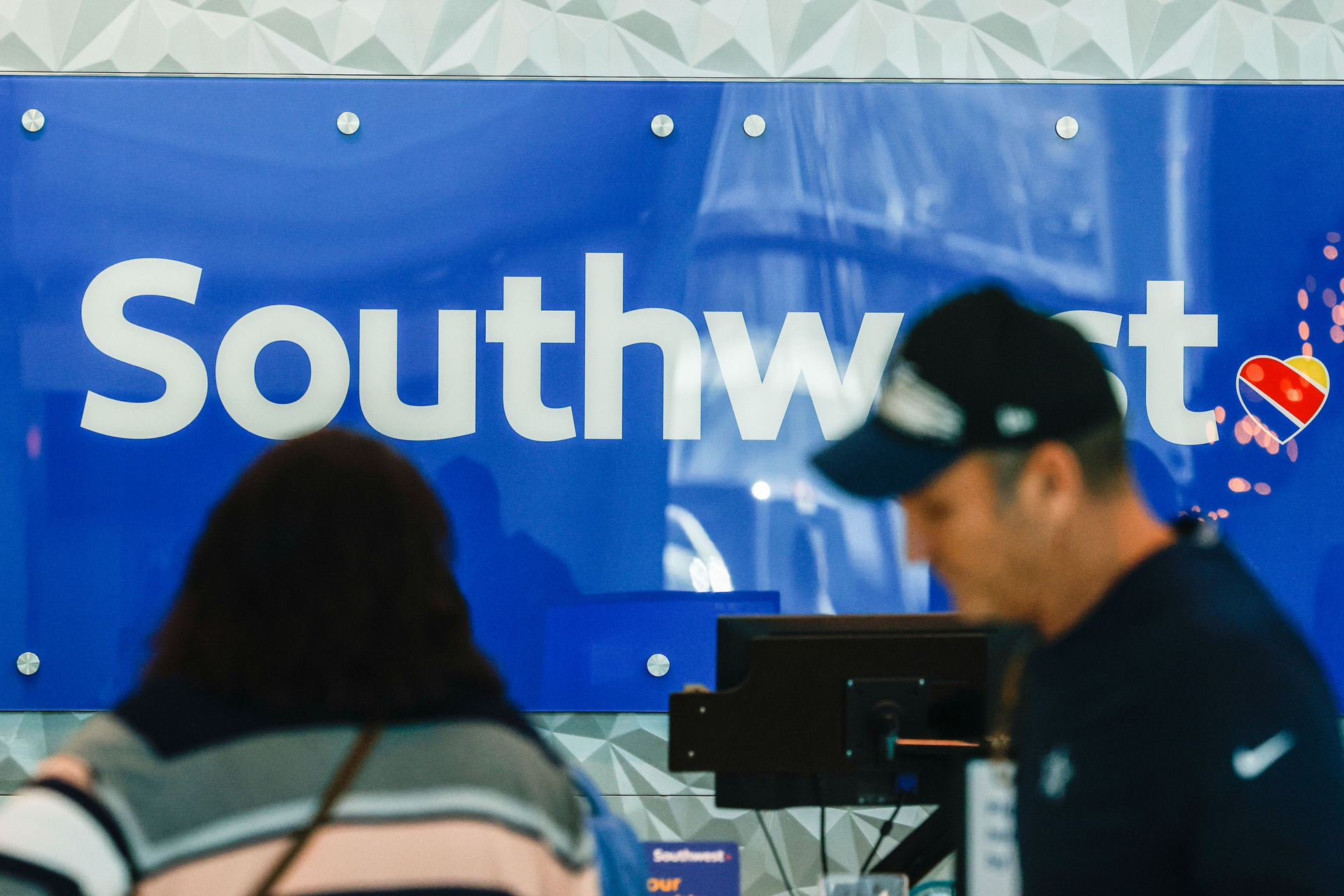 Customers in line at the Southwest front desk at Dallas Love Field airport in Dallas on Wednesday, Jan. 4, 2023.