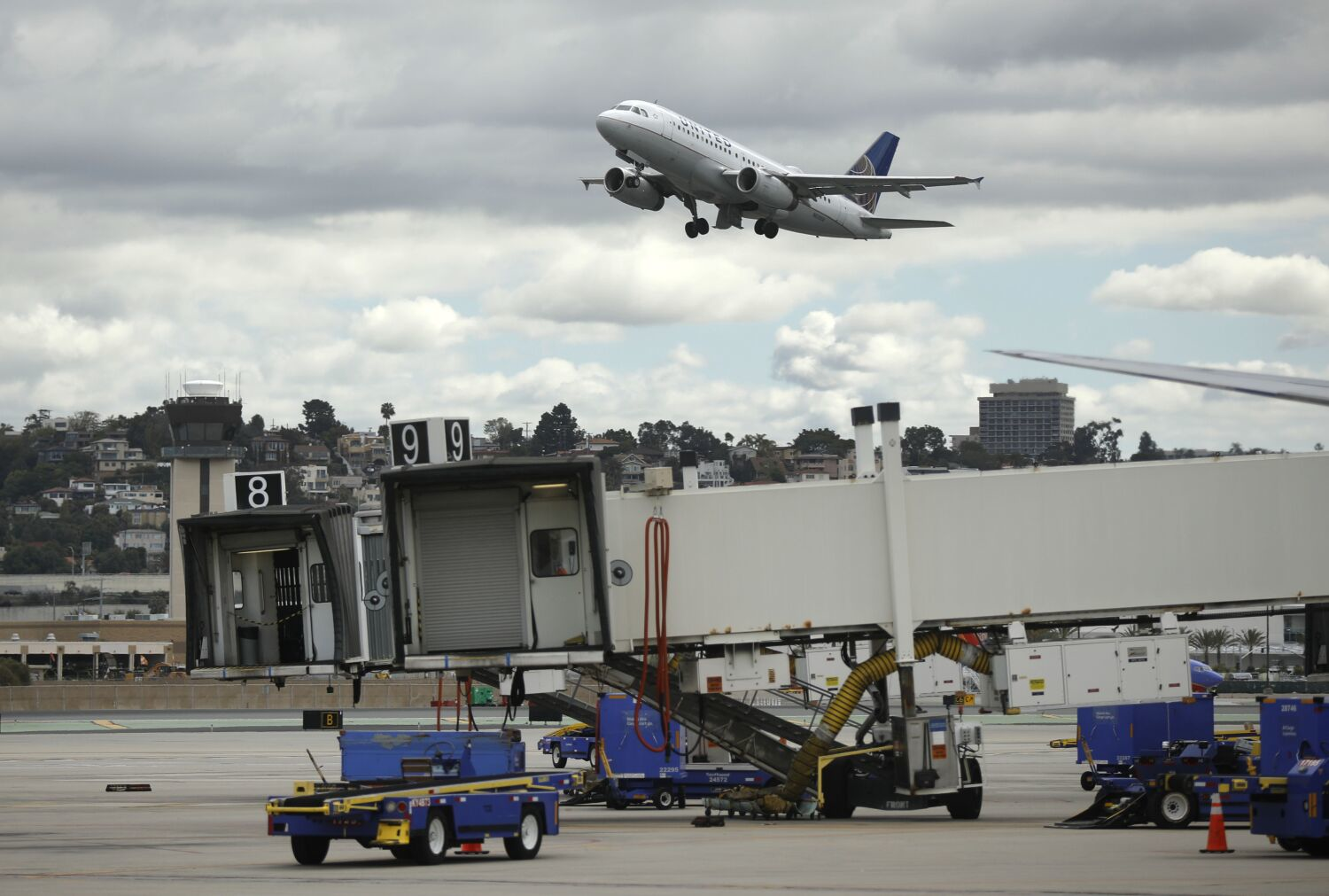 An United Airlines left takes off from San Diego International Airport headed for Houston on March 24, 2020. The airport has seen a dramatic drop in travel since the outbreak of coronavirus.