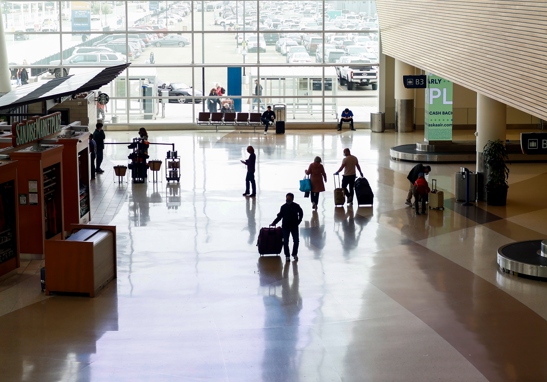 SAN JOSE, CALIFORNIA - FEBRUARY 20: Passengers walk inside Norman Y. Mineta San Jose International Airport in San Jose, Calif., on Sunday, Feb. 20, 2022.