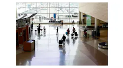 SAN JOSE, CALIFORNIA - FEBRUARY 20: Passengers walk inside Norman Y. Mineta San Jose International Airport in San Jose, Calif., on Sunday, Feb. 20, 2022.