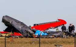 Officials, including those from the Federal Aviation Administration, survey damage from a Boeing B-17 Flying Fortress and a Bell P-63 Kingcobra crash a day earlier at the Dallas Executive Airport on Sunday, Nov. 13, 2022. Officials, including those from the Federal Aviation Administration, survey damage from a Boeing B-17 Flying Fortress and a Bell P-63 Kingcobra crash a day earlier at the Dallas Executive Airport on Sunday, Nov. 13, 2022.