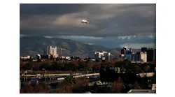 SAN JOSE, CALIFORNIA - DECEMBER 8: An airplane flies over downtown San Jose, Calif., into the the Mineta San Jose Airport on Sunday, Dec. 8, 2019.