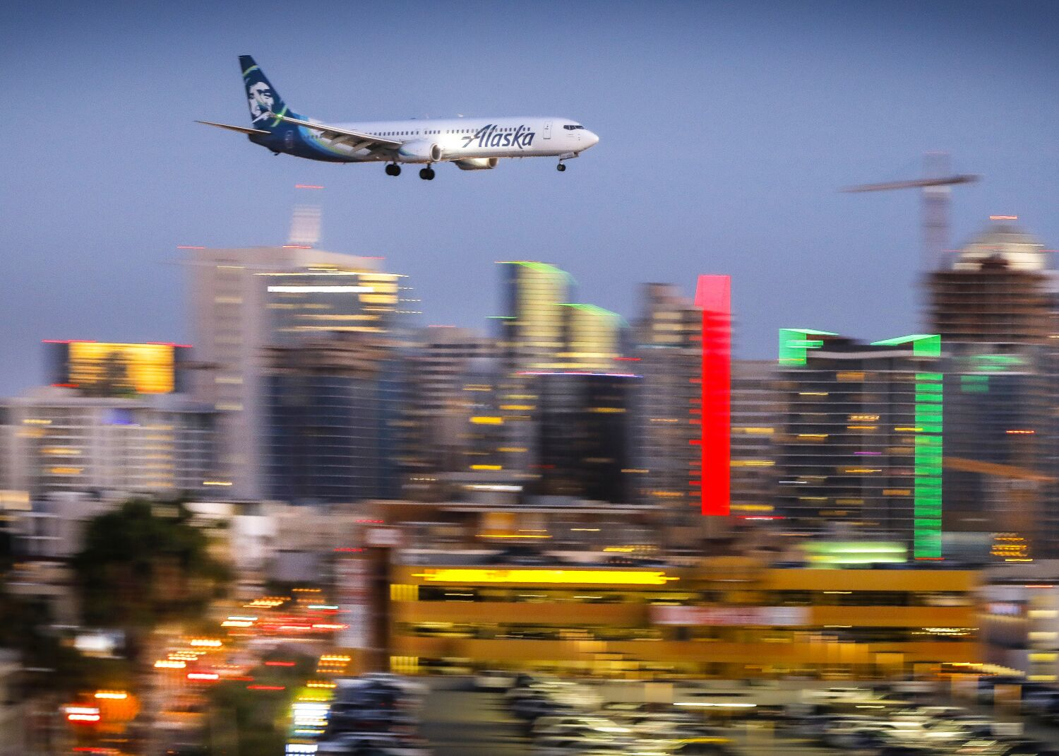 An Alaska Airlines Boeing 737 passes downtown San Diego moments before arriving at San Diego International Airport, May 7, 2018.