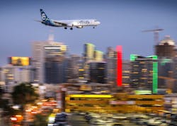 An Alaska Airlines Boeing 737 passes downtown San Diego moments before arriving at San Diego International Airport, May 7, 2018.