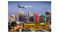 An Alaska Airlines Boeing 737 passes downtown San Diego moments before arriving at San Diego International Airport, May 7, 2018.
