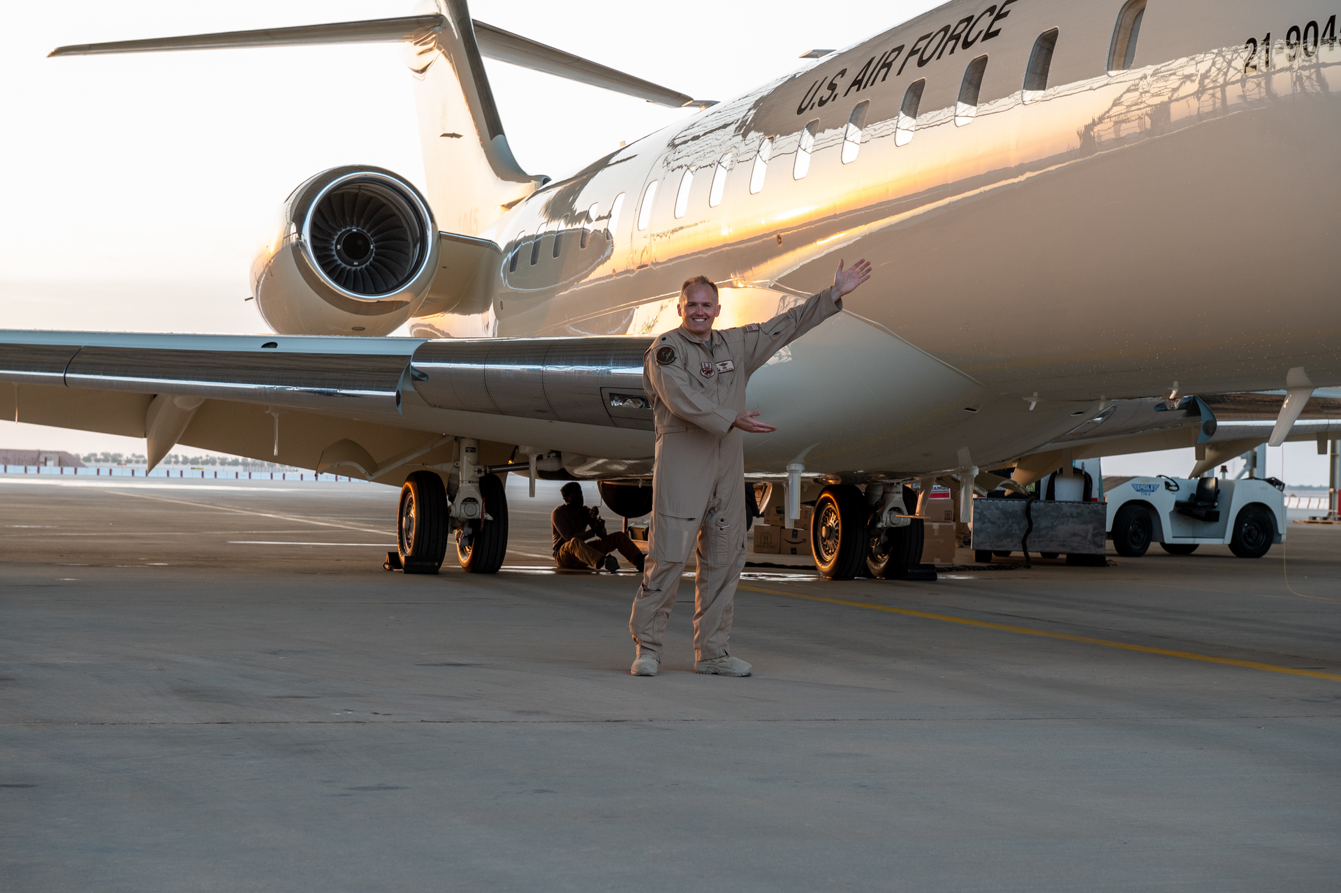U.S. Air Force Lt. Col. Todd Arthur, 430th Expeditionary Electronic Communications Squadron commander, poses for a photo next to new U.S. Air Force E-11A BACN after its arrival at Prince Sultan Air Base, Kingdom of Saudi Arabia, Dec. 16, 2022. The E-11A BACN is the newest addition to 430th Expeditionary Electronic Communications Squadron's fleet. Commonly known as Battlefield Airborne Communications Node, or BACN, this aircraft extends the range of communications channels and enables better communication among units.