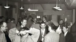 Aviation enthusiasts gather at Curtiss-Wright Airport, now Timmerman Airport, in Milwaukee on Jan. 26, 1953, to organize the group that would be named the Experimental Aircraft Association.