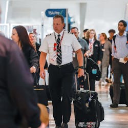 Southwest Airlines pilot Elden L. Hampton Jr. walks surrounded by travelers at the Dallas Love Field in Dallas on Thursday, Jan. 19, 2023. Southwest Airlines pilot Elden L. Hampton Jr. walks surrounded by travelers at the Dallas Love Field in Dallas on Thursday, Jan. 19, 2023.
