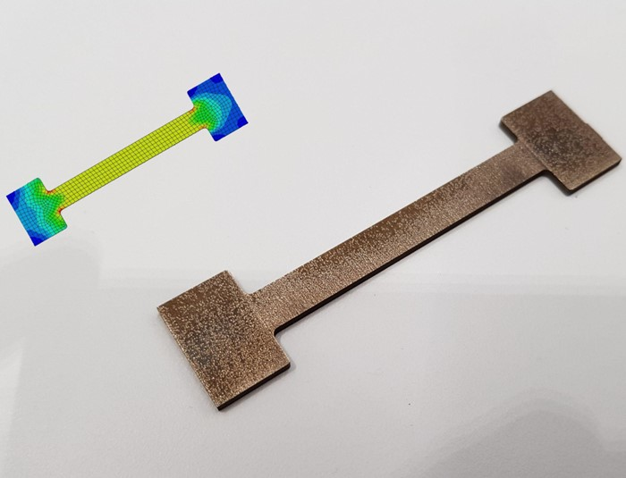 This is an example of a metal sample for mechanical tests. By subjecting it to stress, the researchers measure the material&rsquo;s strength, identify weak spots, such as the red spots on the stress map, and determine primary modes of failure.