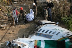 Nepal army, police and rescuers recover the body of a victim who died in a Yeti Airlines plane crash in Pokhara, Monday, Jan. 16, 2023. Nepal army, police and rescuers recover the body of a victim who died in a Yeti Airlines plane crash in Pokhara, Monday, Jan. 16, 2023.