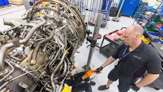 Airframe and Power Plant mechanics work on a Gear Turbine engine in Delta&apos;s new facility Tuesday, Feb. 7, 2023.