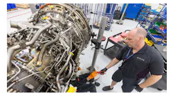 Airframe and Power Plant mechanics work on a Gear Turbine engine in Delta's new facility Tuesday, Feb. 7, 2023.