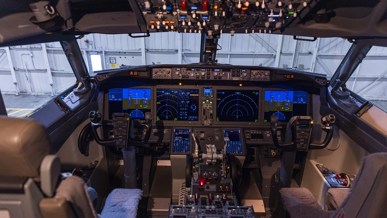 The control board lights up in the Boeing ecoDemonstrator cockpit in a hanger at Boeing Field on Sept. 27, 2021. High-profile near-hit incidents don&rsquo;t necessarily mean there is a trend toward more pilot or controller mistakes occurring, according to the FAA and aviation experts, who say it is still the safest time to fly in history.