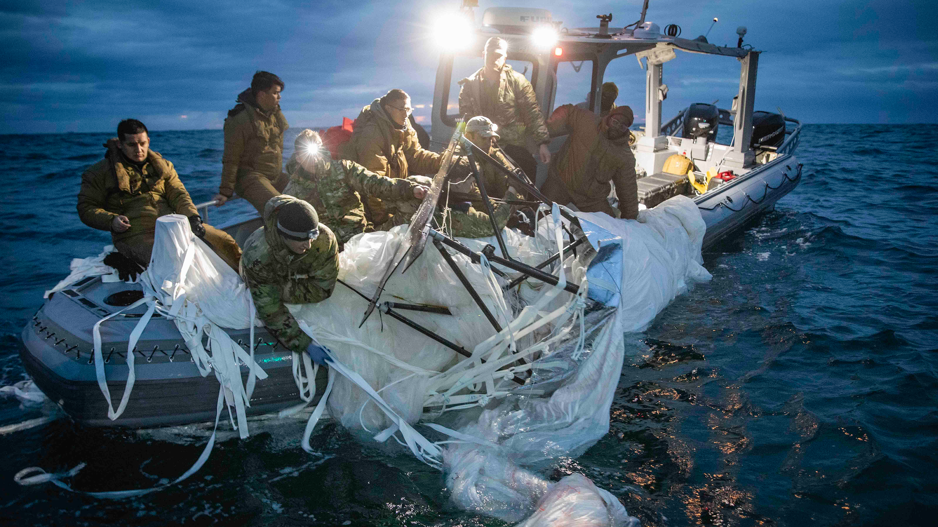 Sailors assigned to Explosive Ordnance Disposal Group 2 recover a high-altitude surveillance balloon off the coast of Myrtle Beach, South Carolina, Feb. 5, 2023.