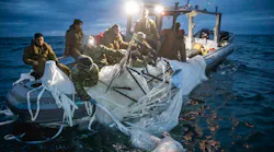 Sailors assigned to Explosive Ordnance Disposal Group 2 recover a high-altitude surveillance balloon off the coast of Myrtle Beach, South Carolina, Feb. 5, 2023.