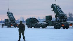 A soldier stands in front of PATRIOT (Phased Array Tracking Radar to Intercept on Target) surface-to-air missile systems during a military exercise at Warsaw Babice Airport, Poland on Feb. 7, 2023. A soldier stands in front of PATRIOT (Phased Array Tracking Radar to Intercept on Target) surface-to-air missile systems during a military exercise at Warsaw Babice Airport, Poland on Feb. 7, 2023.
